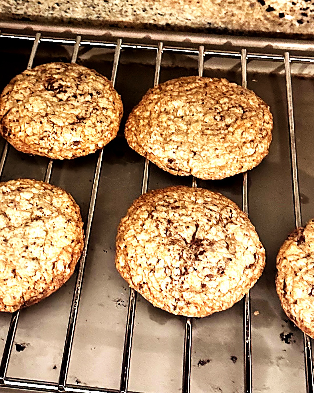 Real Cookie Co. cookies cooling on a wire rack